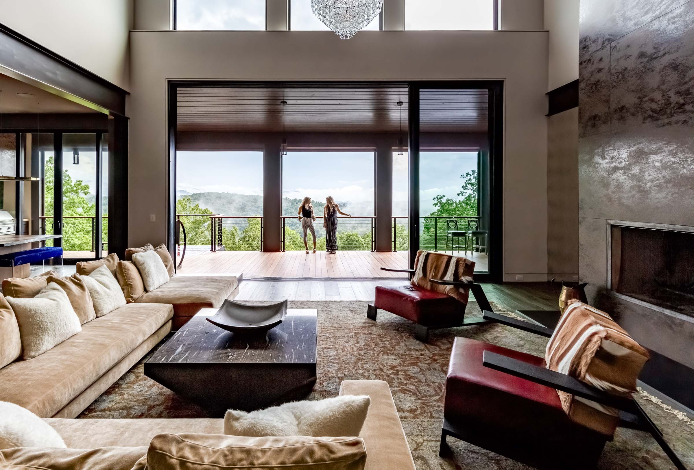 Modern living room with a view, in a neutral palette, in an award-winning house built by Bluestone Cosntruction in Asheville, North Carolina.