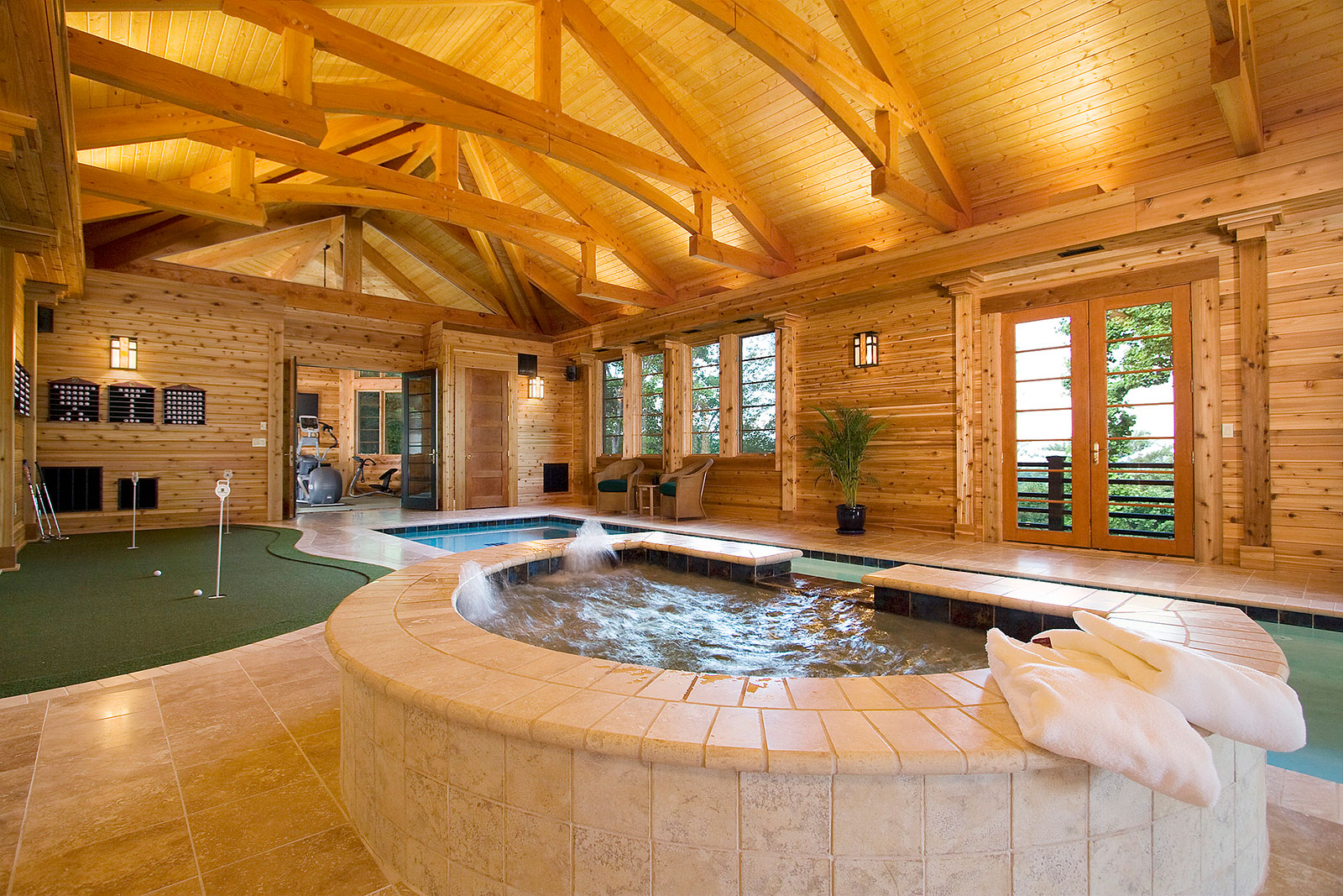 timber-hewn custom-built pool house by Bluestone Construction
