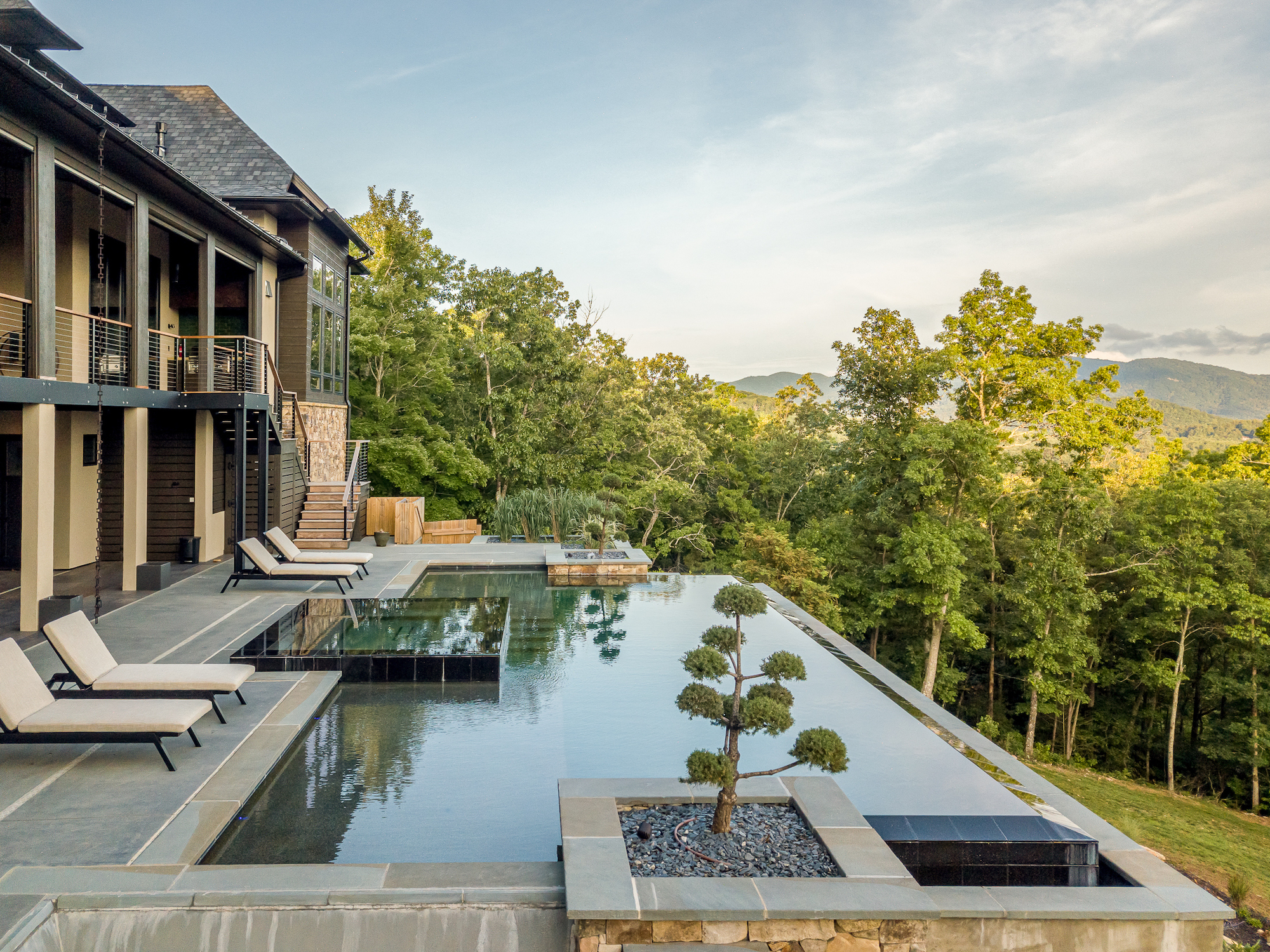 Luxury residential pool in Asheville with a view of the mountains.