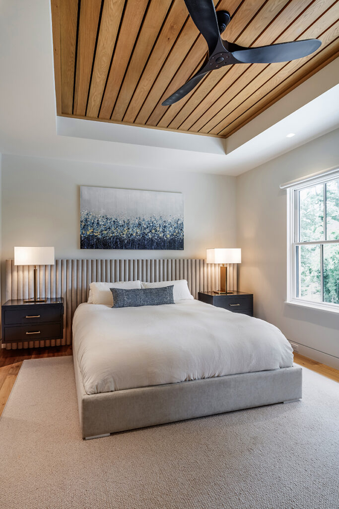 Modern bedroom with white oak wood plank ceiling