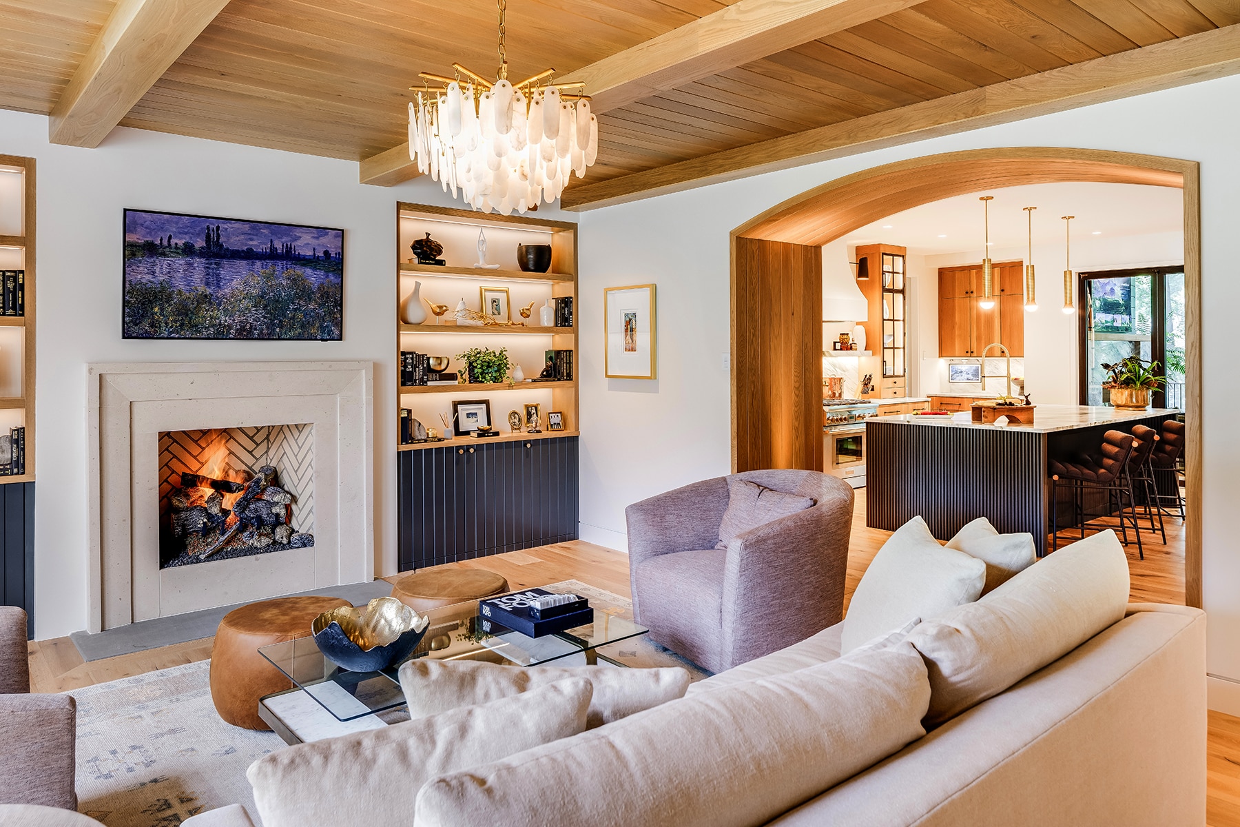 From the Visual Comfort chandelier to the white oak hardwood floors, this living room is stunning. Built by luxury custom home builder Bluestone Construction in Greenville SC